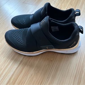 Women’s Black Athletic Slip-On Sneakers with Gold Accent